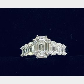 AN 18CT WHITE GOLD BAGUETTE, MARQUISE & ROUND BRILLIANT CUT DIAMOND CLUSTER RING, hand-made, this piece of sta