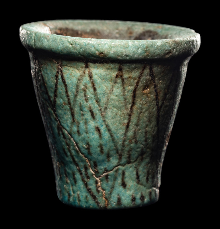 An Egyptian Faience Cup
Height 2 inches (5.4 cm).