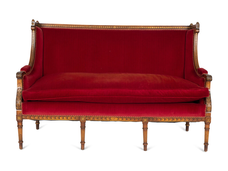 A Louis XVI Style Parcel Gilt Walnut Sofa
Height 41 1/4 x width 63 x depth 24 inches.