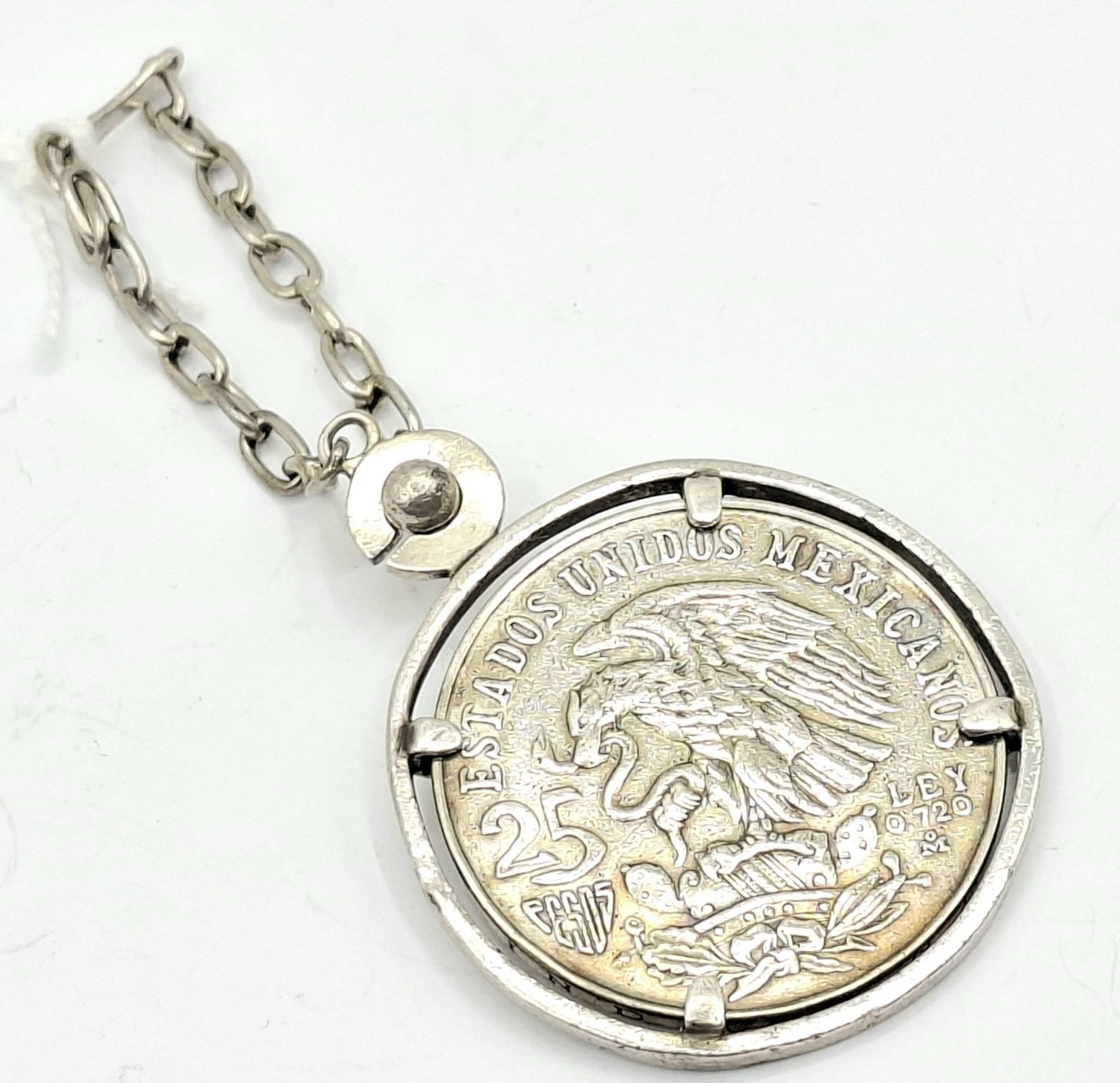 1134 · MEXICAN OLYMPIC COIN IN SURROUND