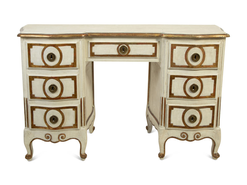 A Venetian Style Painted and Parcel Gilt Dressing Table
Height 29 x width 48 3/4 x depth 19 inches.