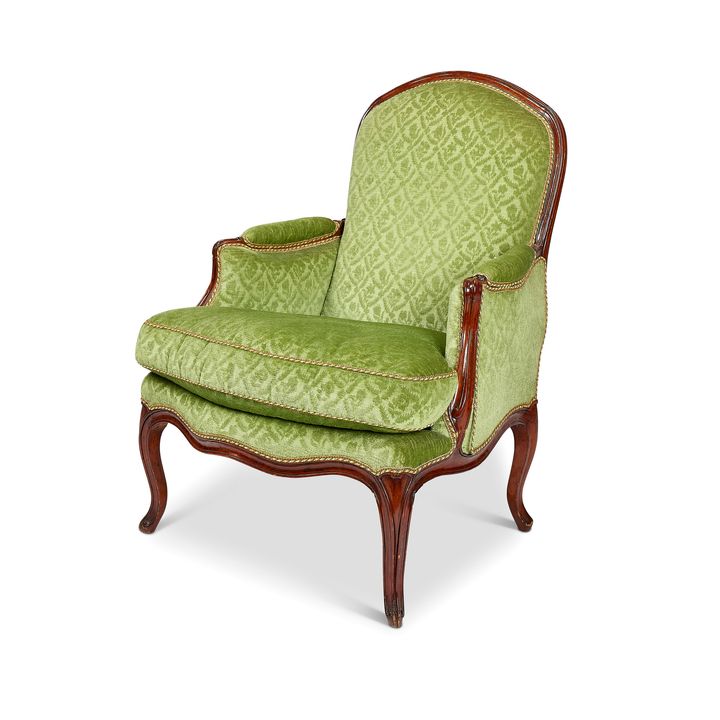 A Louis XV carved walnut bergere