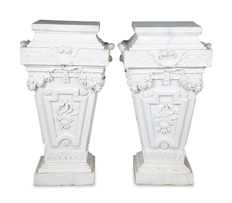 A Pair of Neoclassical Style Carved White Marble Pedestals
Height 39 x width 22 inches.