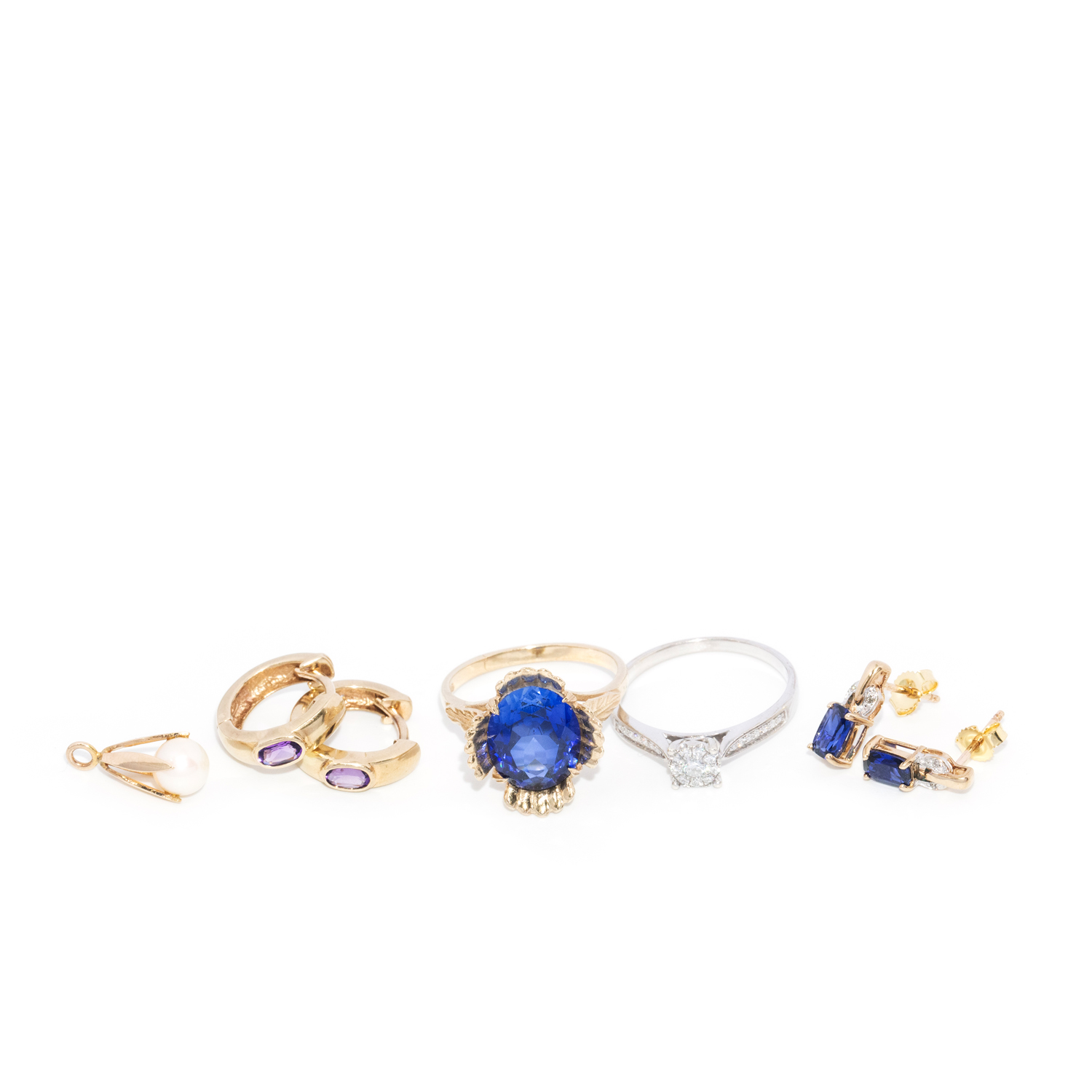 2 Gold Rings, 2 pairs of Gold Earrings and a Gold Pendant