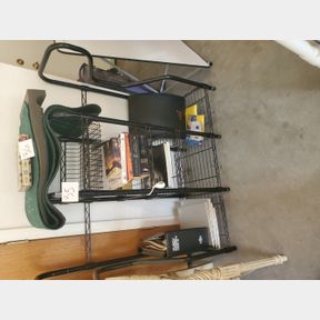 Metal wire shelving unit with some awesome books