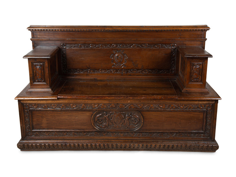 An Italian Carved Walnut Cassapanca
Height 39 1/2 x width 66 x depth 21 1/4 inches.