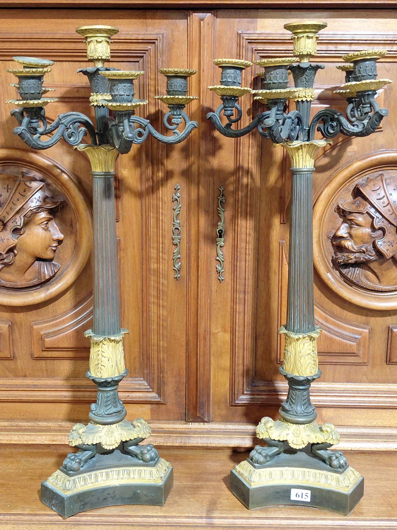 615 · A PAIR OF FRENCH EMPIRE BRONZE CANDLESTICKS