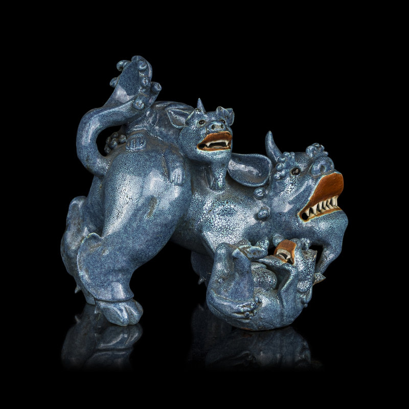 A Chinese Robin's Egg Glazed Porcelain Figural Group of Fu Lions