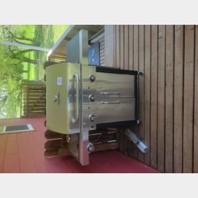 Char Broil large gas grill with additional accessories behind and below the deck