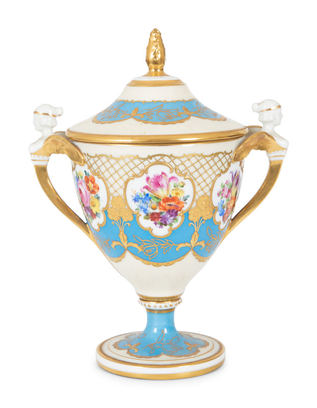 A Fürstenberg Porcelain Gilded Two-Handled Figural Urn
Height 10 inches.