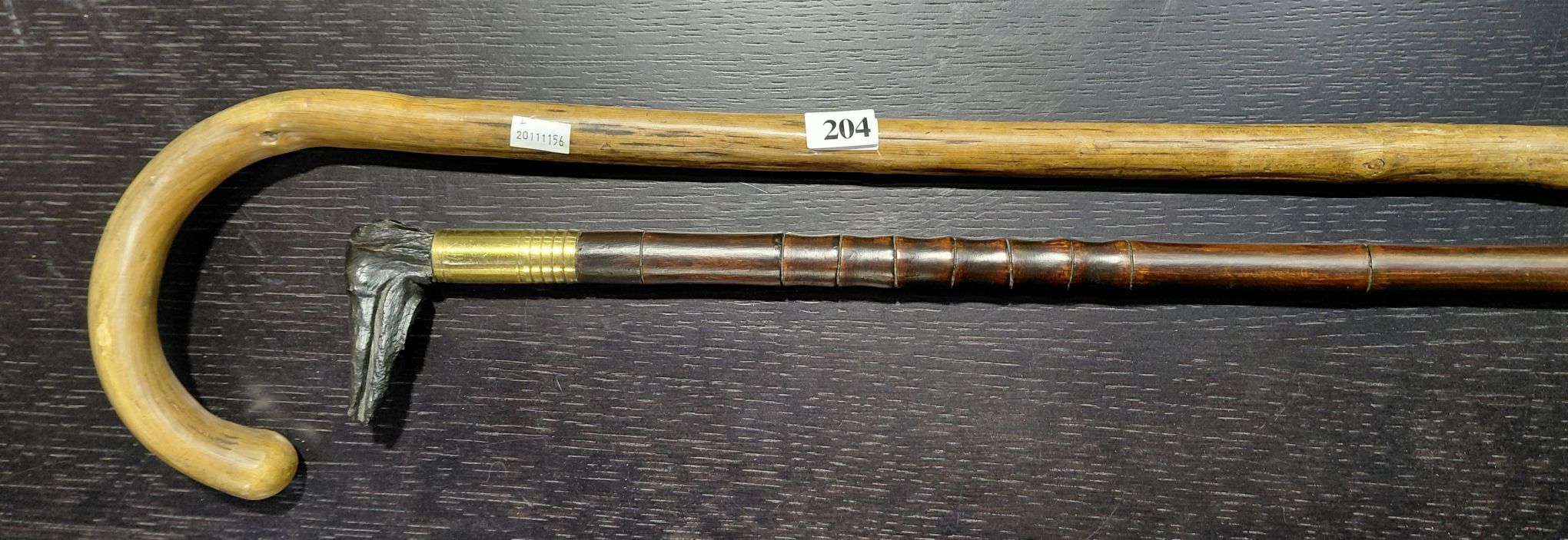 204 · TWO WOODEN WALKING STICKS