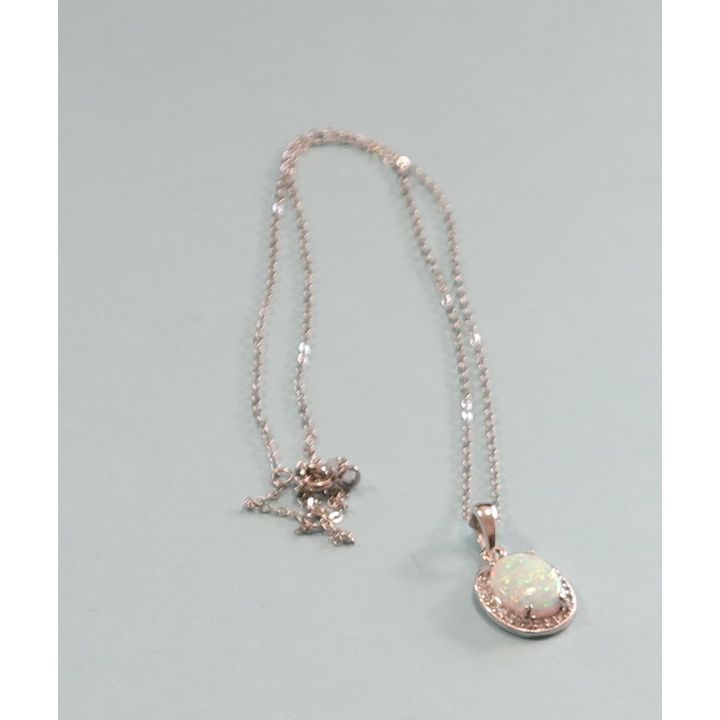 A STERLING SILVER AND OPAL PENDANT,