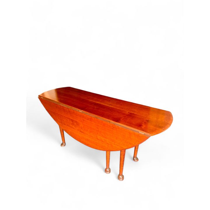A George II style cherrywood and oak drop flap dining / hunt table