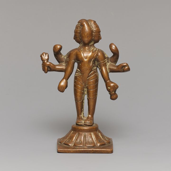 An Indian copper alloy figure of a three-headed deity. 19th century or earlier