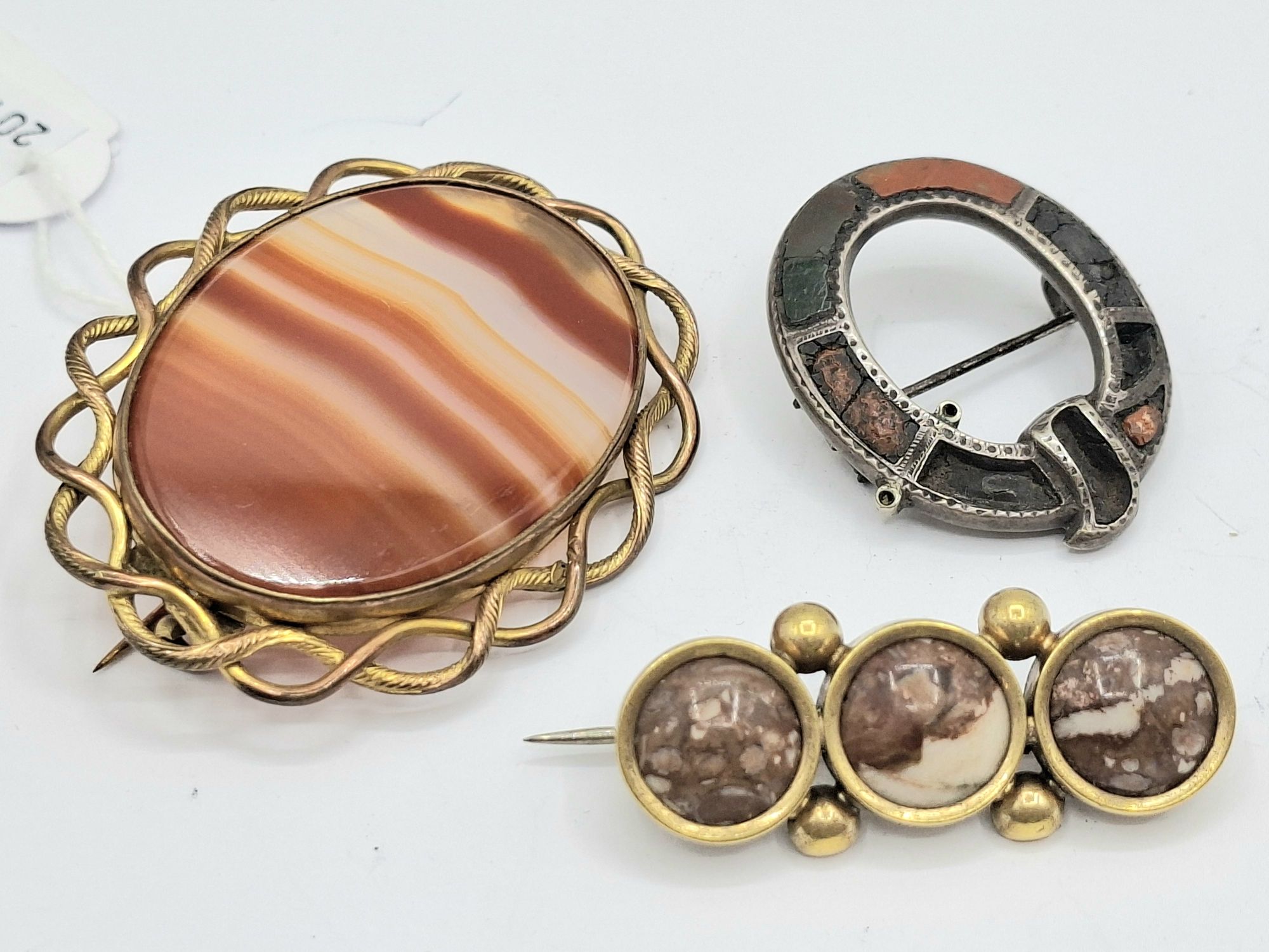 1018 · THREE ANTIQUE SCOTTISH BROOCHES