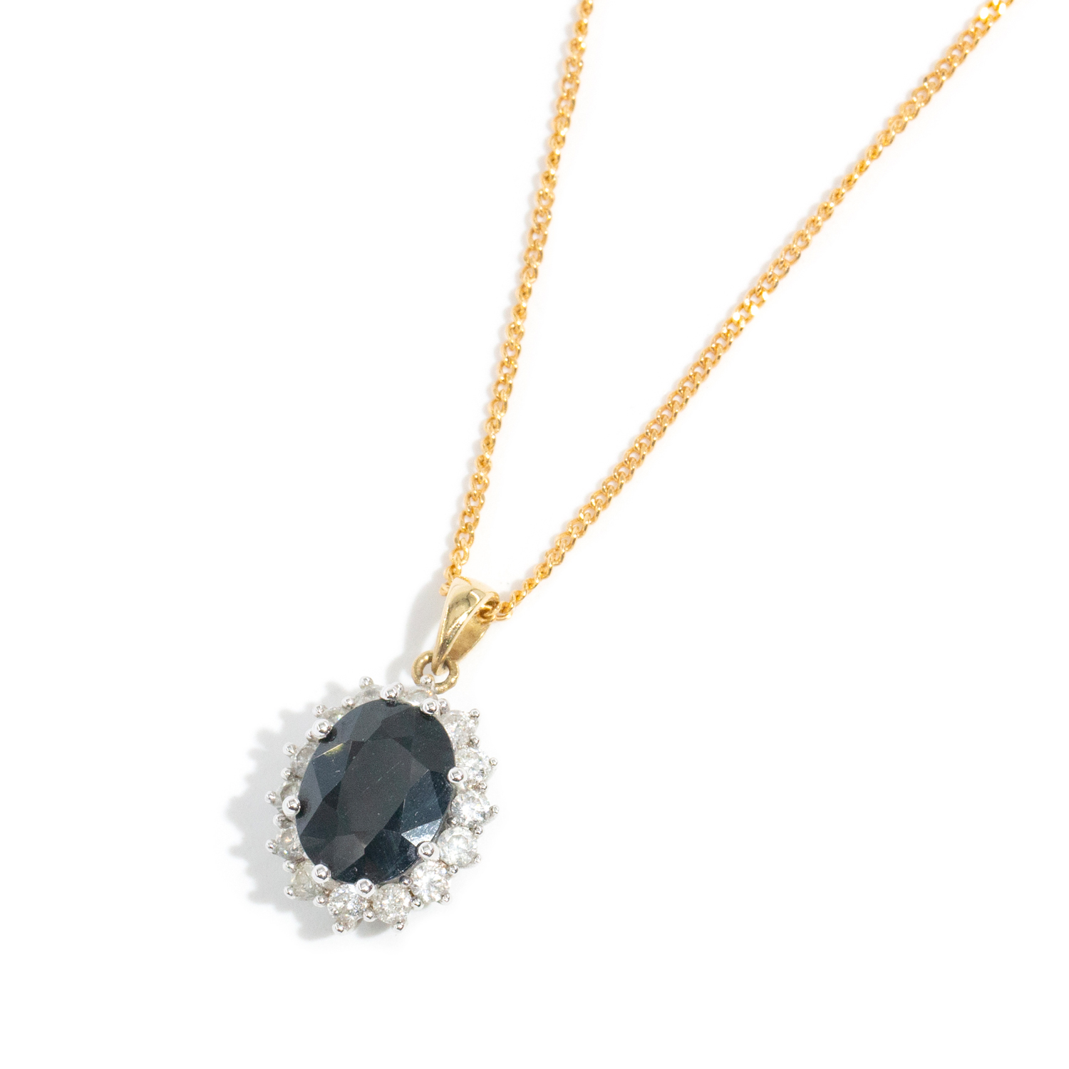 Dark Blue Sapphire & Diamond Halo Pendant on 9ct Gold Chain