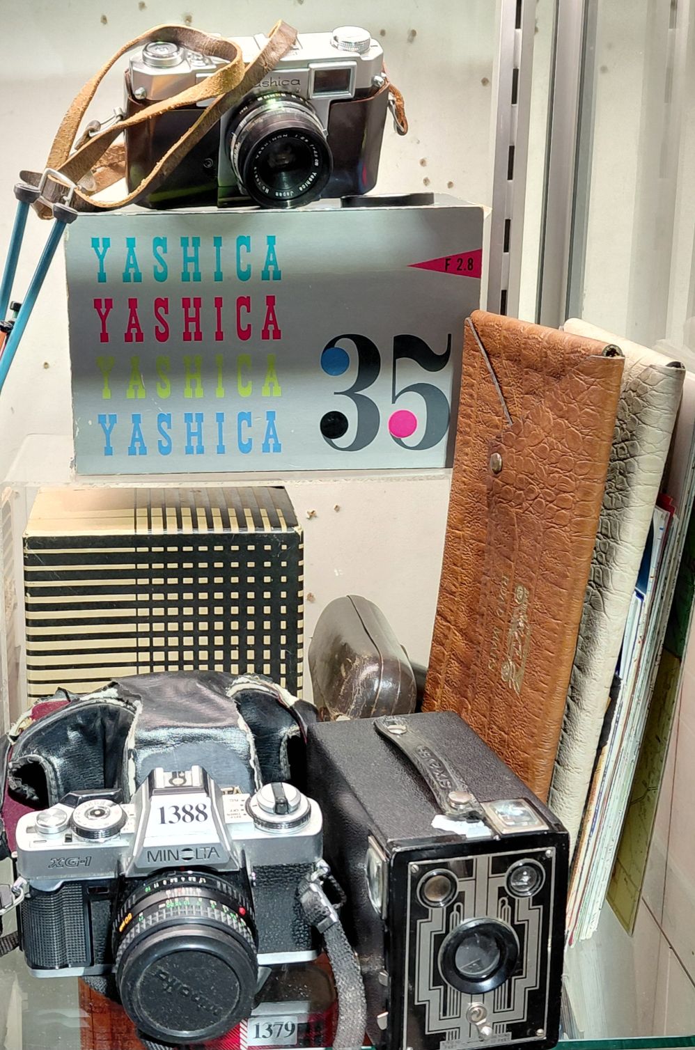 Three Vintage Cameras And Maps