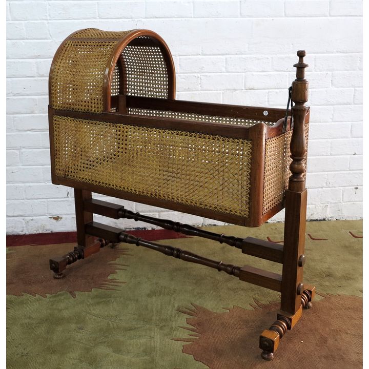 RATTAN AND MAHOGANY CRIB ON STAND