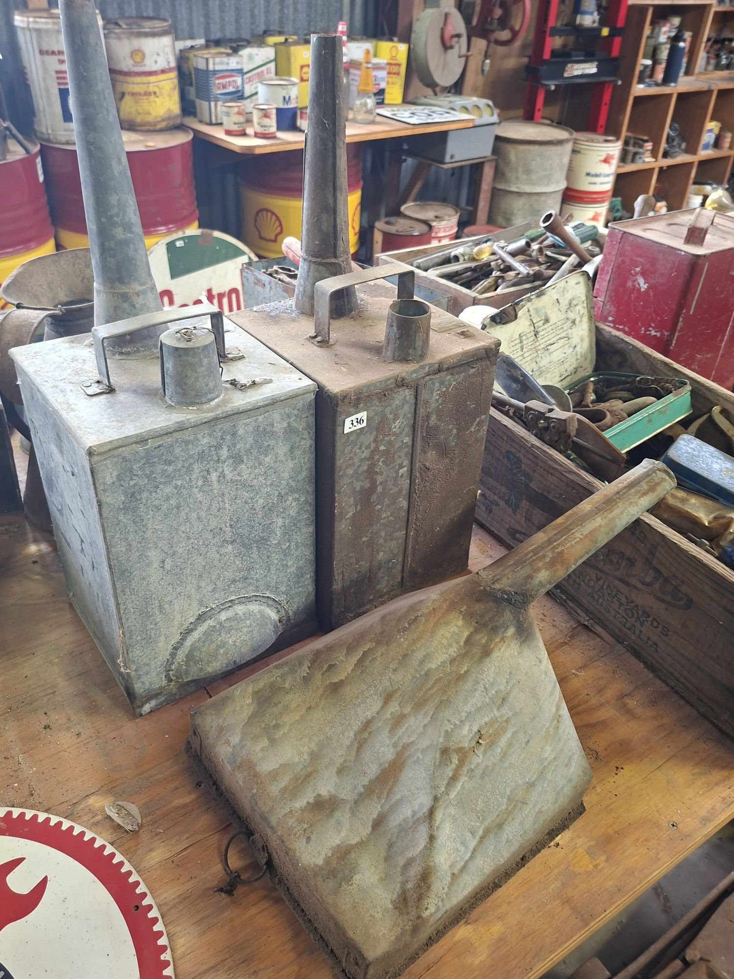 Oil Cans And A Funnel