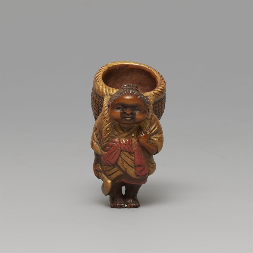 A lacquered boxwood netsuke of a chubby woman. 19th century