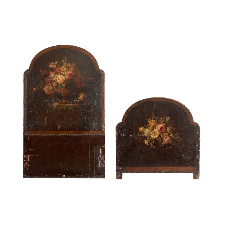 An early 20th century floral painted single bed head and tail board by Heal & Sons Ltd