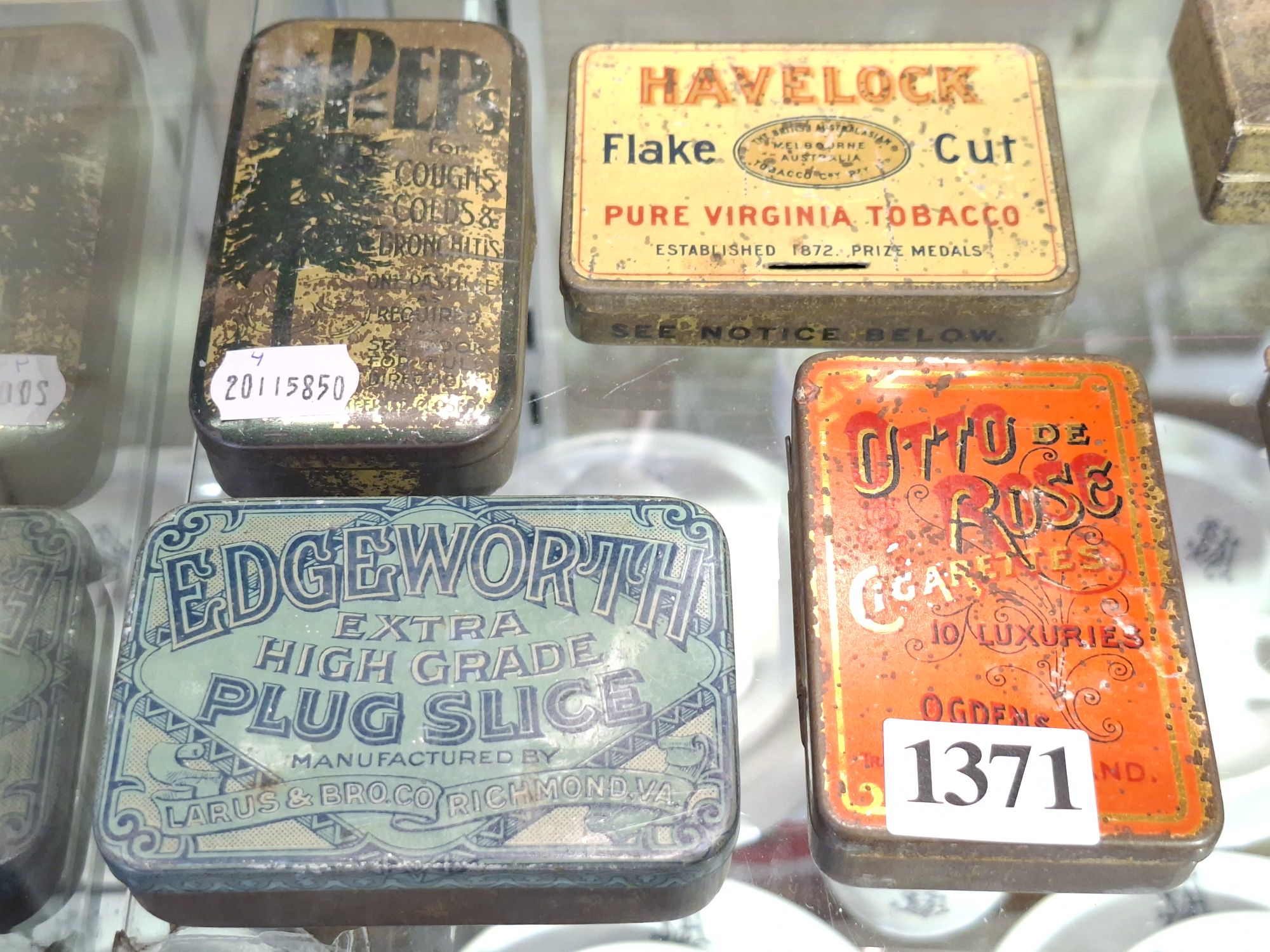 1371 · FOUR VINTAGE TOBACCO TINS