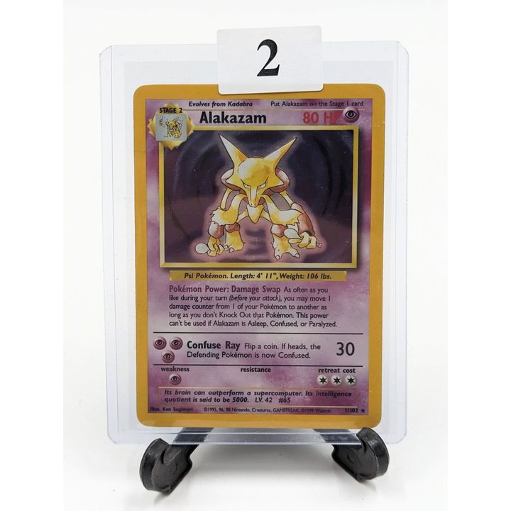 pokemon card 1 102 Charizard 4/102 Shadowless Base Set 1st Edition Holo Rare Discard 2 of the other cards in your hand in order to play this card Alakazam Base Set Unlimited Holo