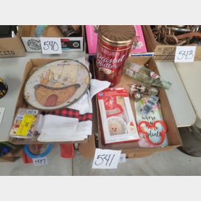 2 Boxes of kitchen towels, cookie cutters and wine stoppers