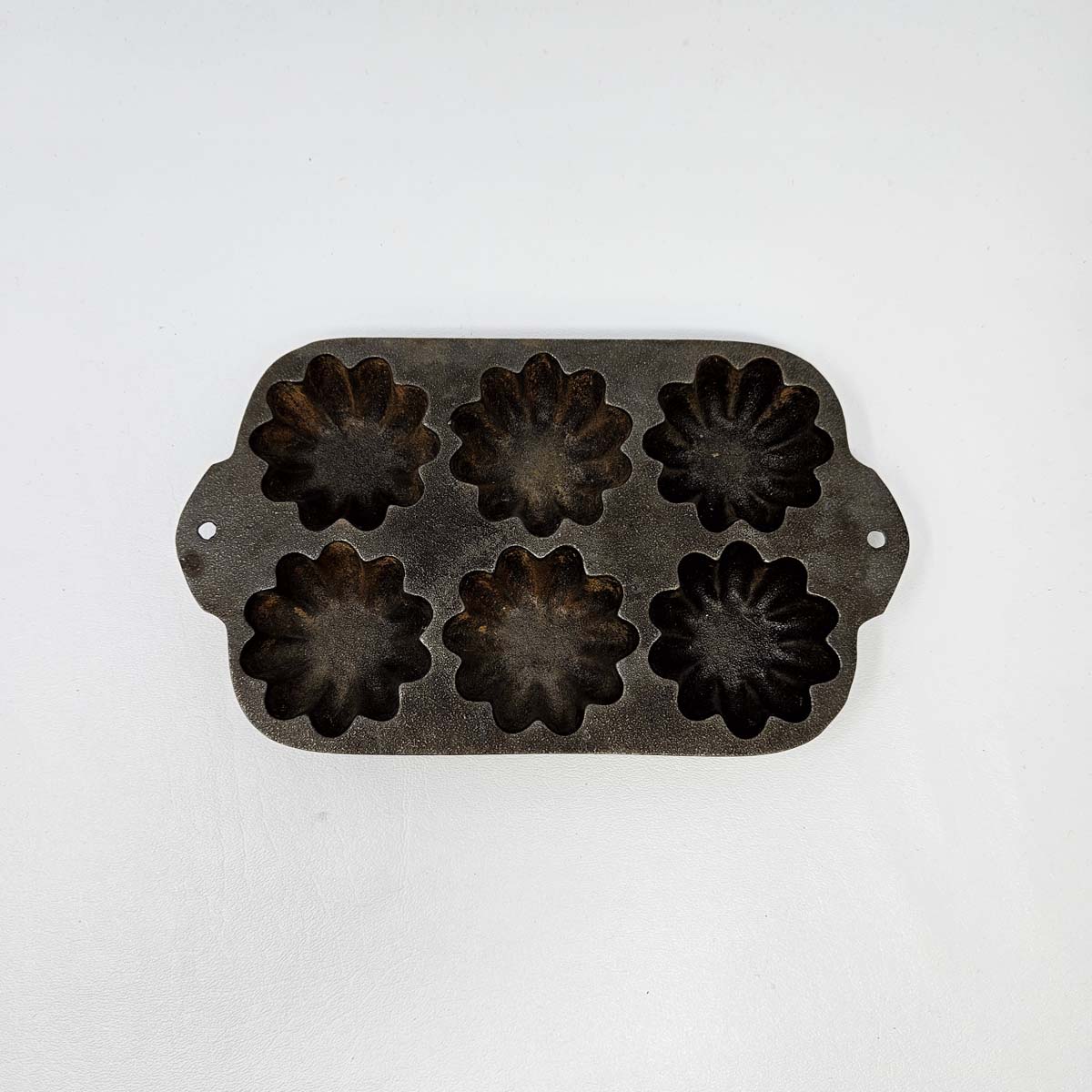 Sold at Auction: Cast Iron Muffin Pan