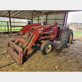 International 574 Tractor, 2250 loader and forks