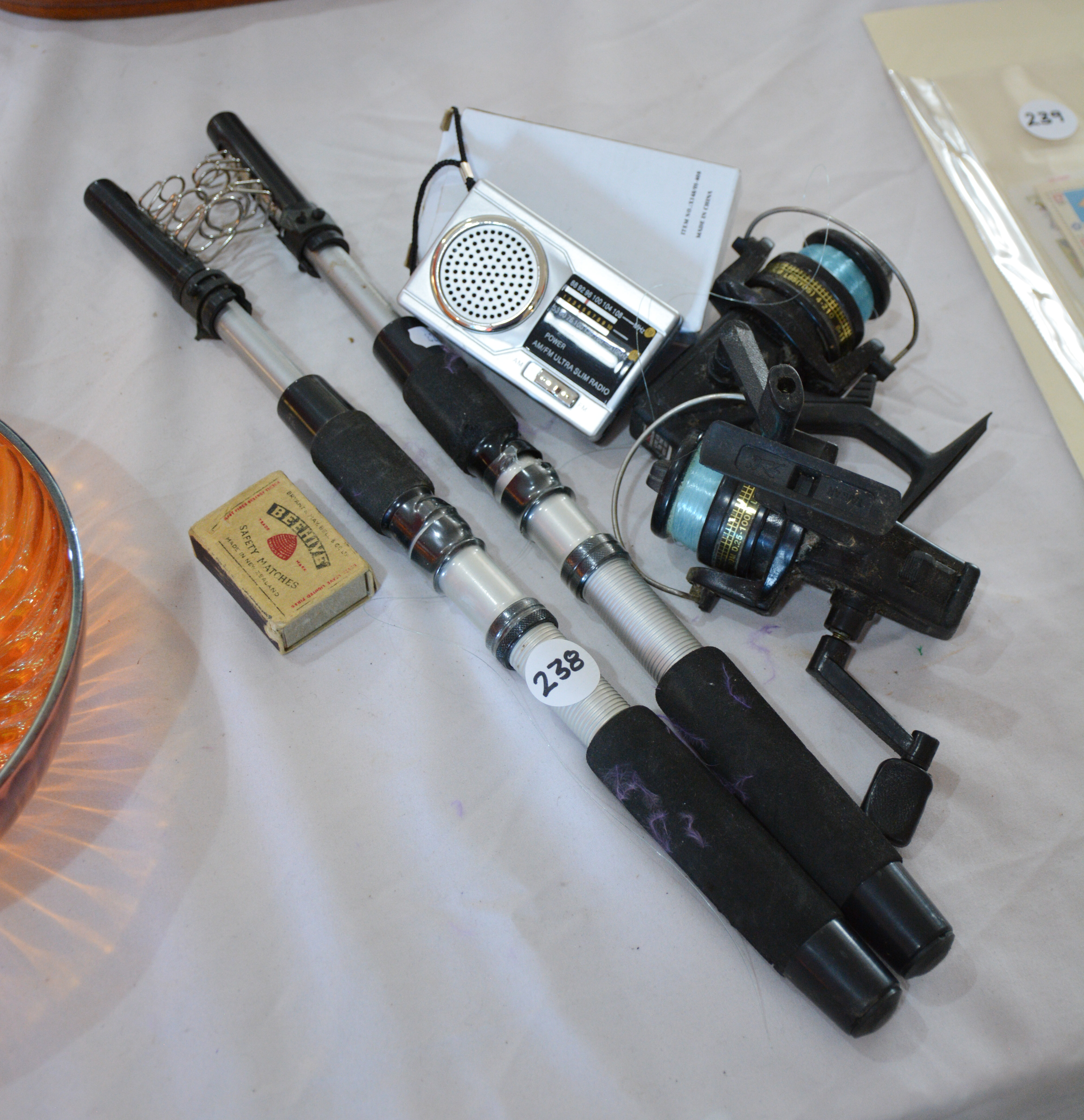 Telescopic Fishing Rods x 2 and Reels x 2 + Radio — sold at auction in New Zealand for $35