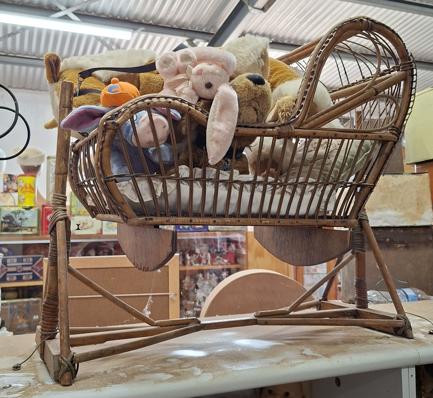 255 · WOVEN CANE DOLLS CRADLE