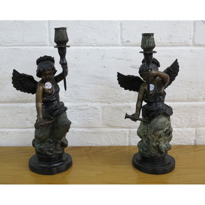 PAIR OF PATINATED METAL CANDLESTICKS