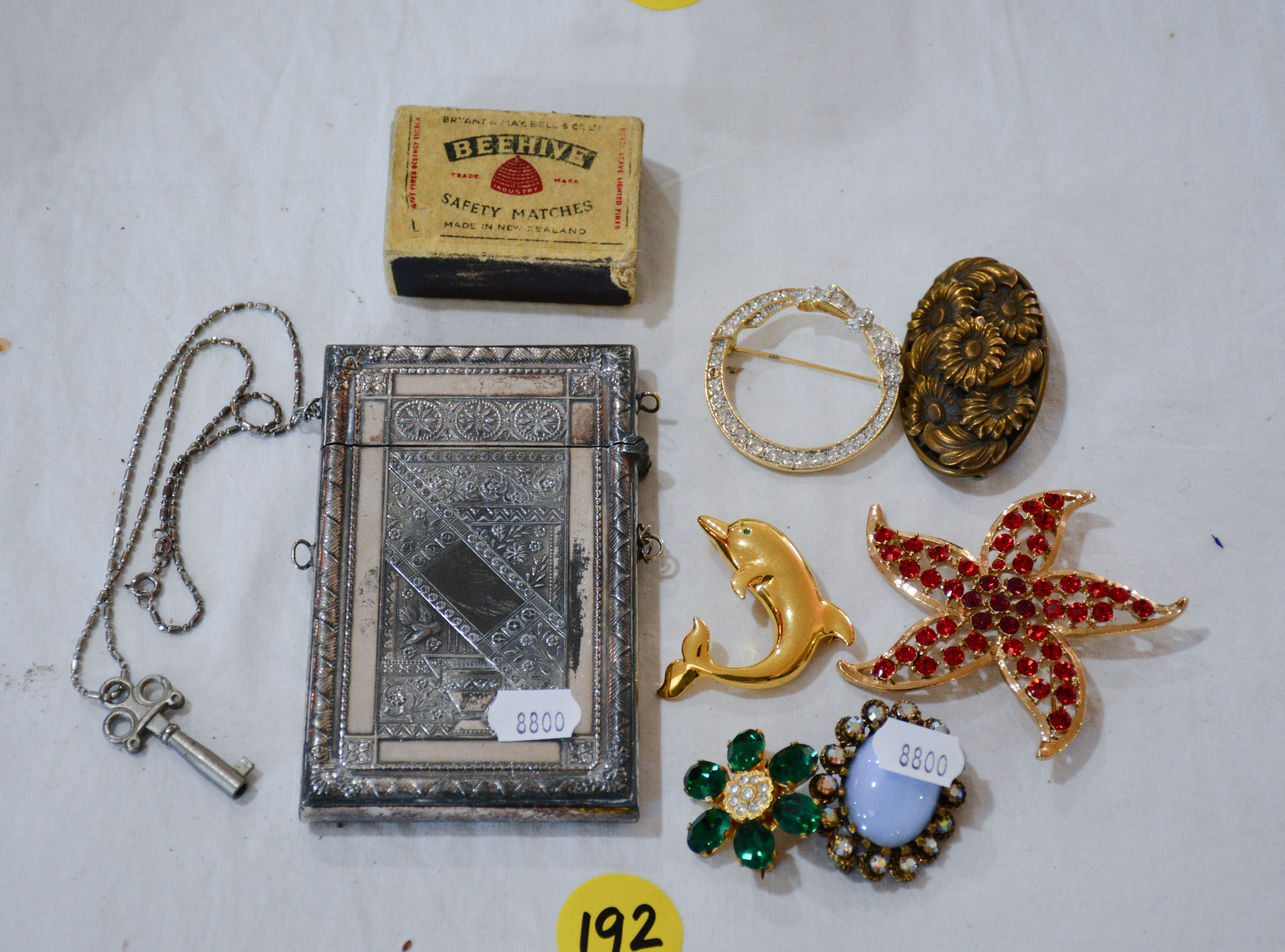 Vintage Card Case and Key + Brooches — sold at auction in New Zealand for $70