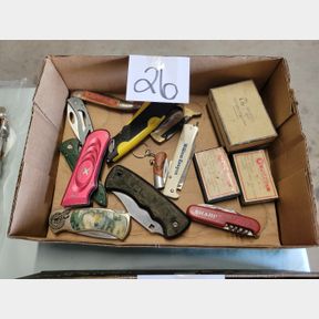 Assorted pocket knives and Coffeyville Pharmacy boxes
