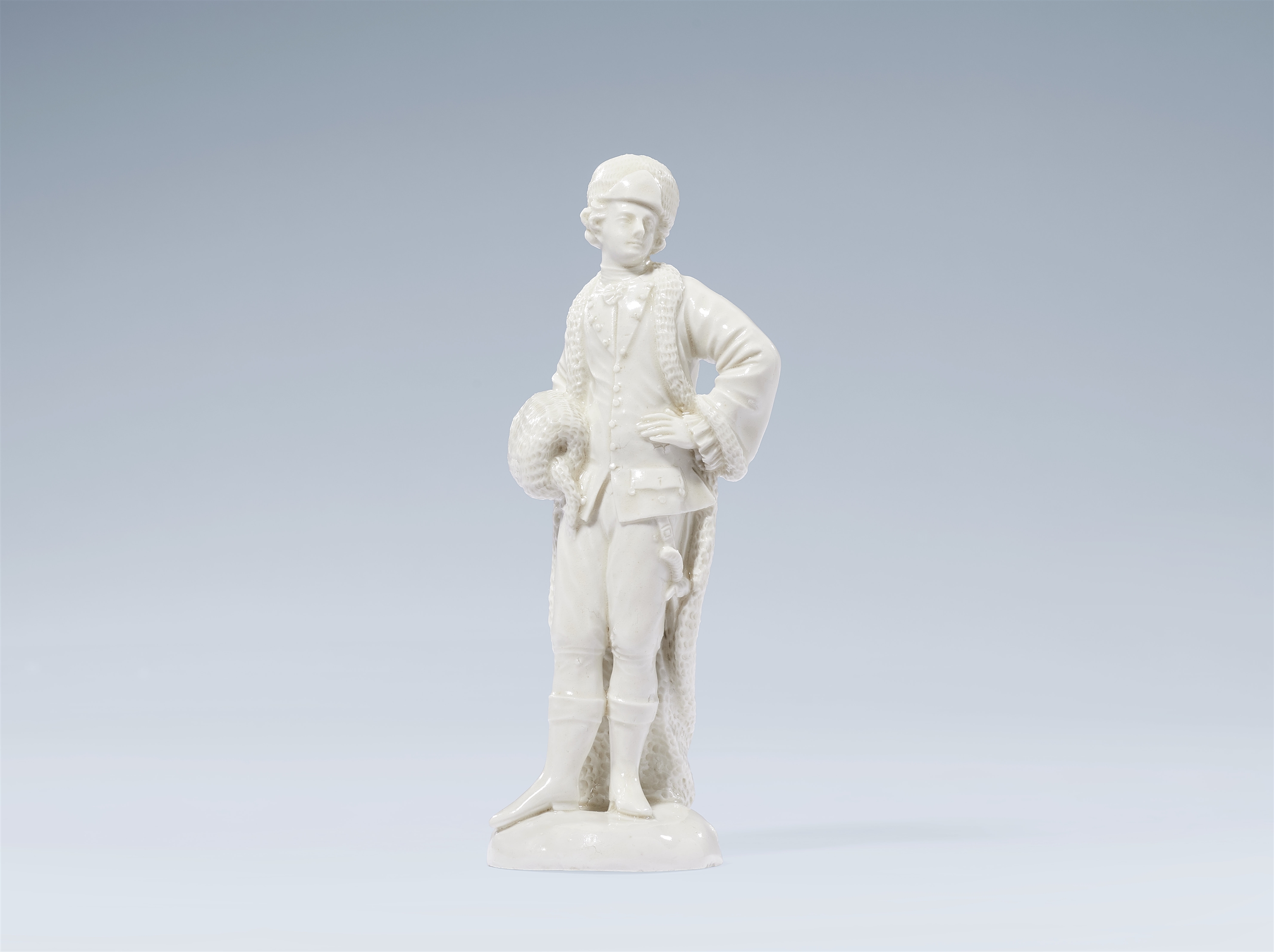 A Ludwigsburg porcelain figure of a cavalier with a muff by Joseph Nees