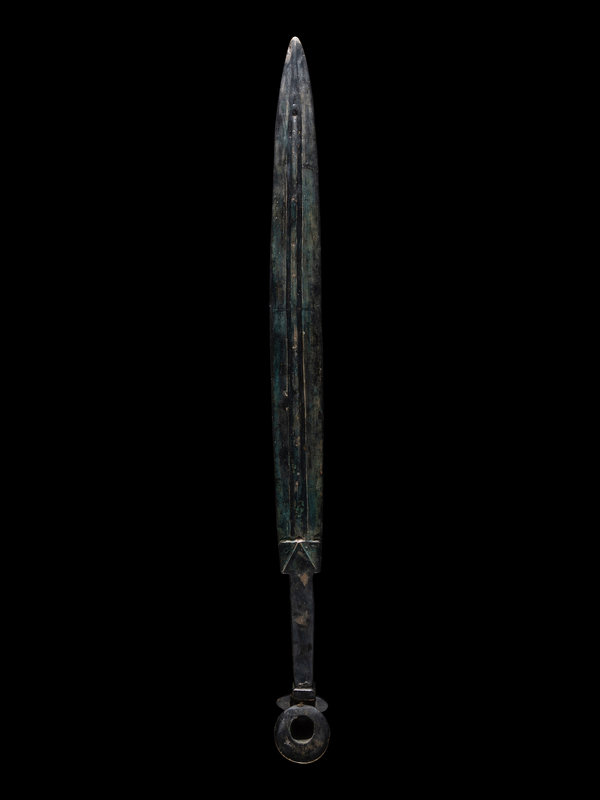 A Luristan Bronze Sword
Length 31 inches (79 cm).