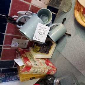 Mug tree, cook books, green pitcher, misc on counter