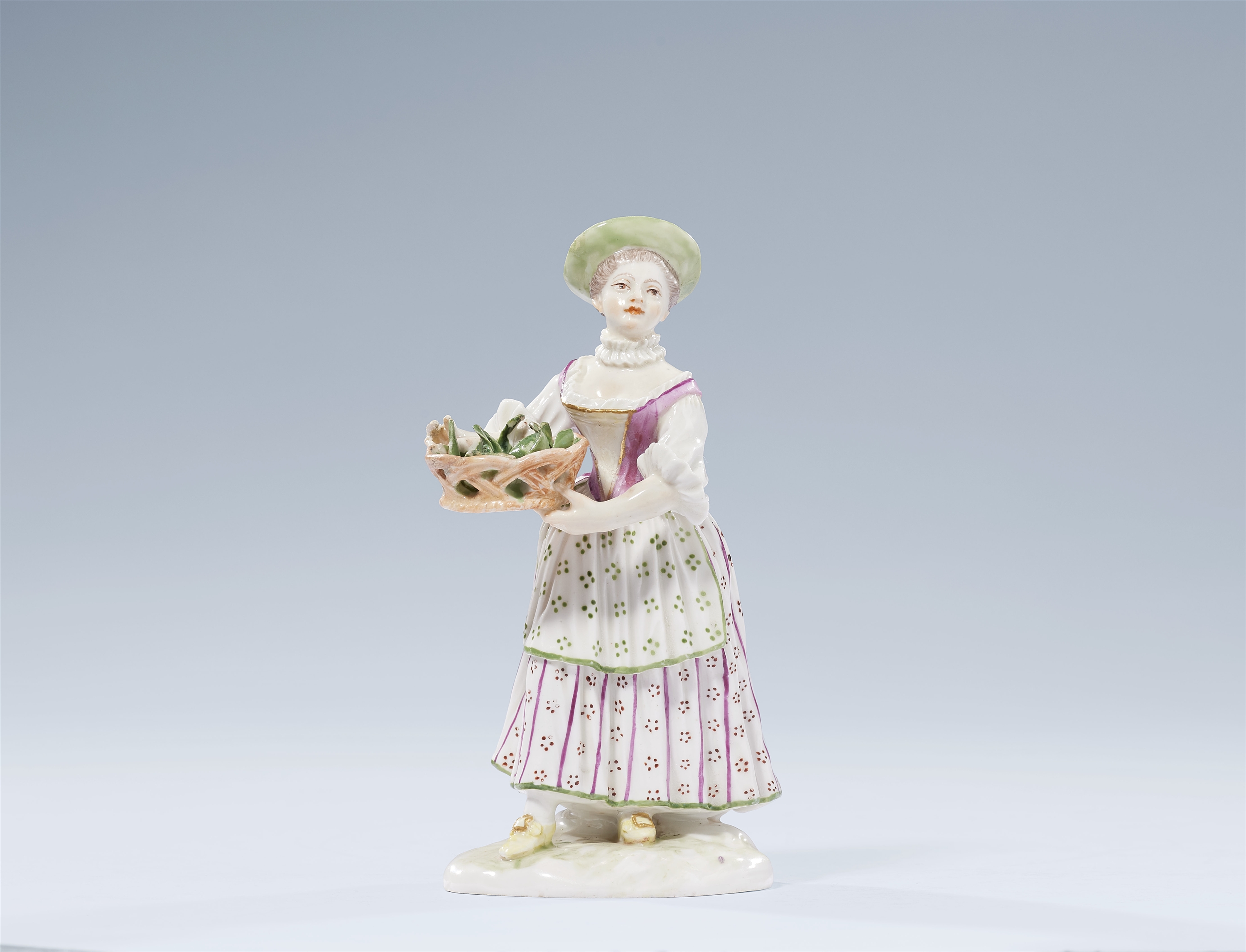 A Ludwigsburg porcelain figure of a vegetable seller by Johann Wilhelm Götz