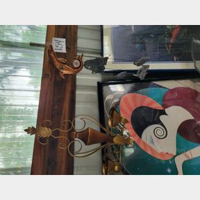 Wind chimes, candle holders and vintage dolphin thermometer