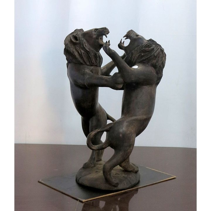 PAIR OF CARVED WOOD FIGHTING LIONS