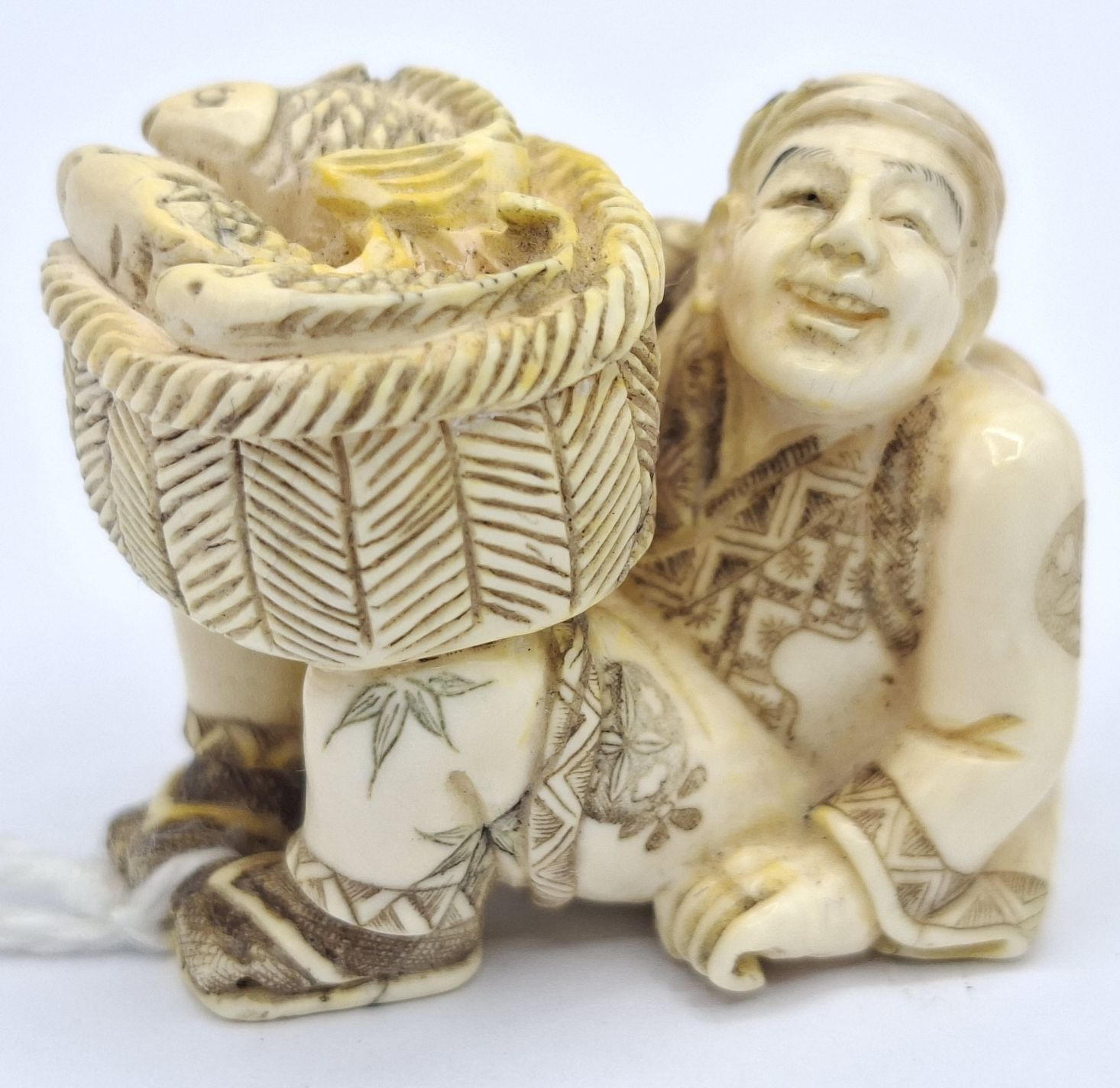 107 · JAPANESE CARVED IVORY NETSUKE