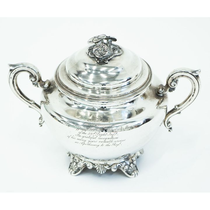A silver scroll handled and lidded bowl