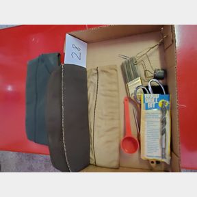 Box of military style hats, drill bit, paint brush