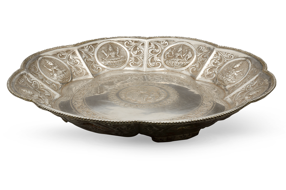 A circular Indian silver plate
