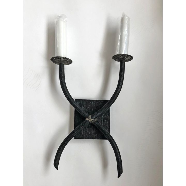A two-branch faux metal wall sconce