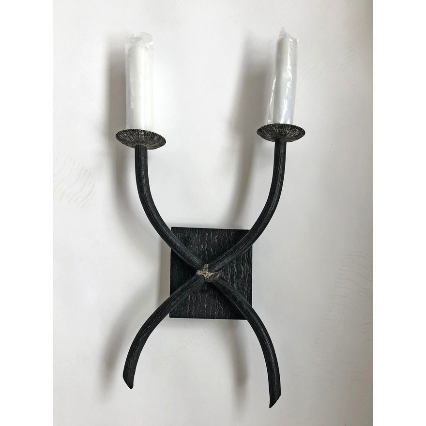 A two-branch faux metal wall sconce
