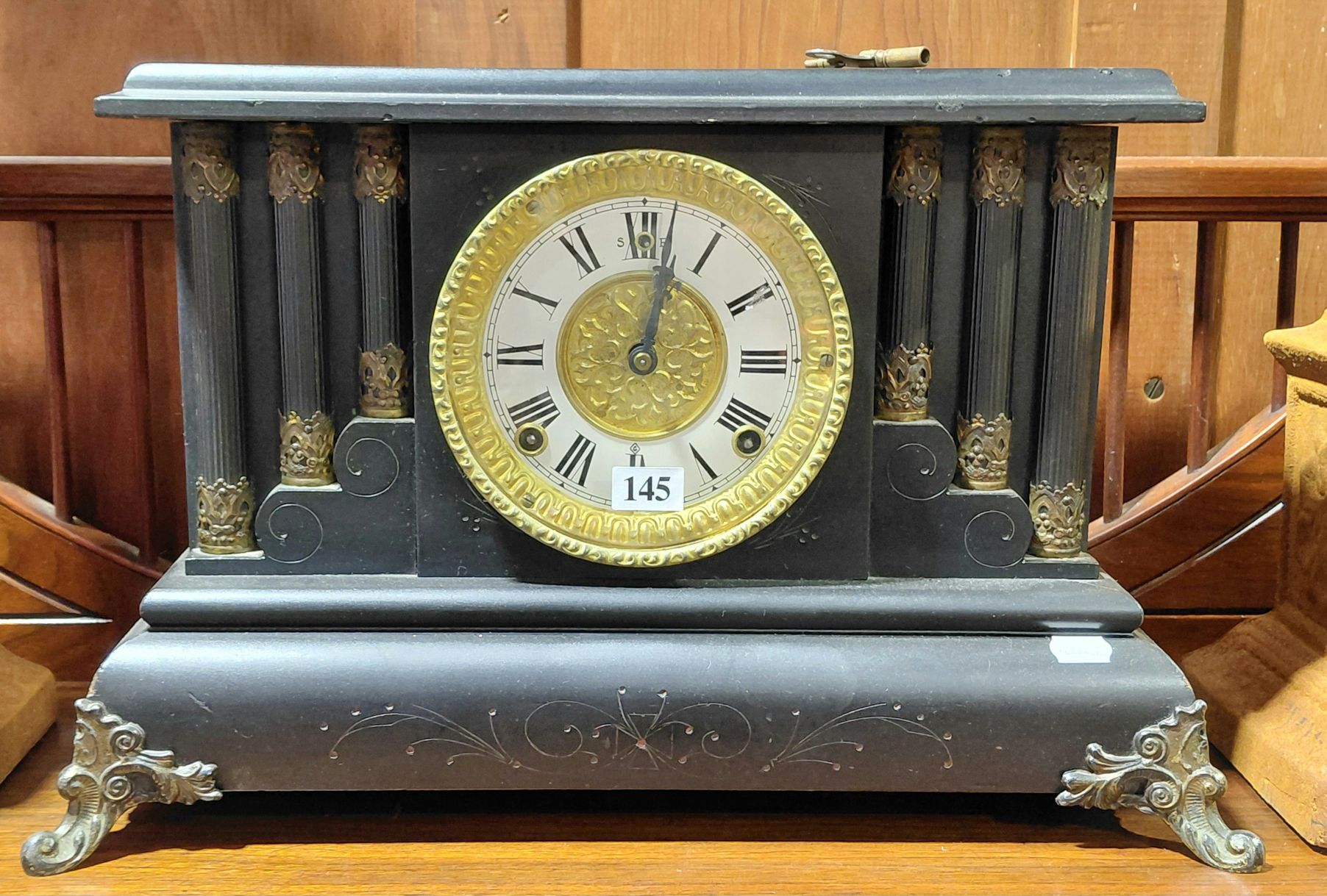 145 · EBONISED WOODEN MANTLE CLOCK