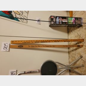 McCormick Deering Hardware and Otasco yardsticks