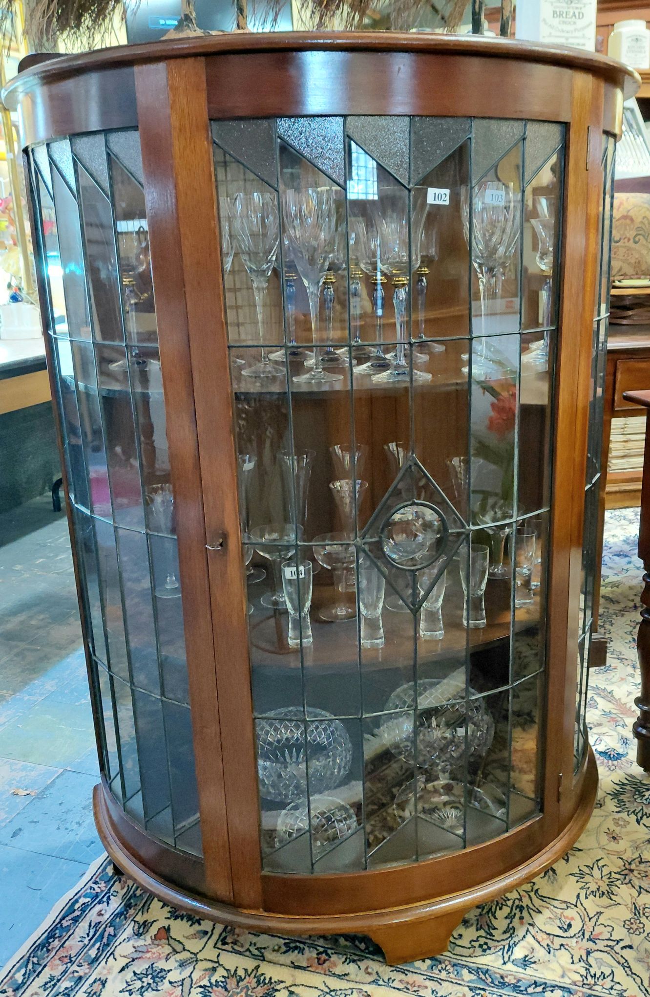 102 · DEMI-LUNE DISPLAY CABINET